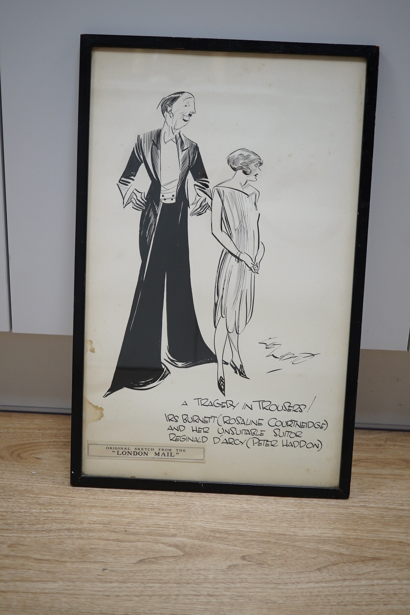 An original pen and ink cartoon for the London Mail, 'A Tragedy in Trousers!' - Iris Burnett (Rosaline Courtneidge) and her Unsuitable Suitor Reginald D'Arcy (Peter Haddon), 49 x 30cm, the husband and wife actors starred